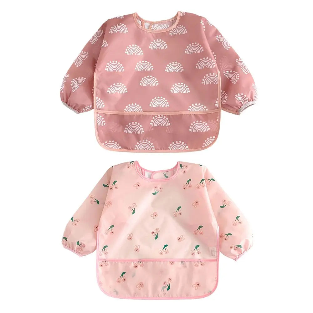A pink 2-pack of waterproof full sleeve baby bibs featuring a rainbow pattern for feeding.