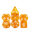 A set of seven translucent orange glitter polyhedral dice, including a tetrahedron and a cube.
