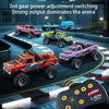 A collection of 3rd gear power adjustment switching off-road cars on a track with a controller visible.