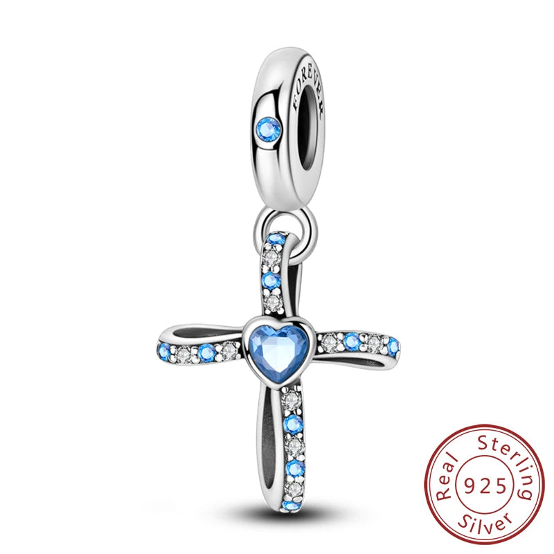 Sterling silver cross charm with a heart pendant and blue stones for DIY jewelry making