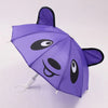 A purple lace-trimmed bear mini doll umbrella with black eyes and nose.