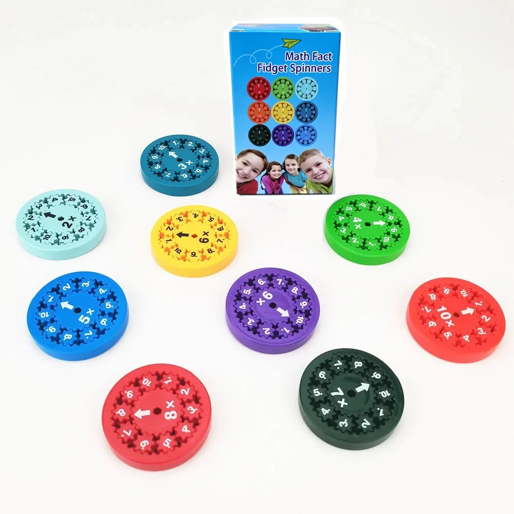 A collection of colorful math fact fidget spinners in various colors and designs, including blue, green, yellow, purple, and 