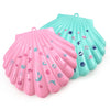 A pink and teal multi-layer shell case for a kids princess makeup toy set.