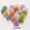 A collection of colorful glitter bouncy balls in various shades including green, purple, orange, and gold.