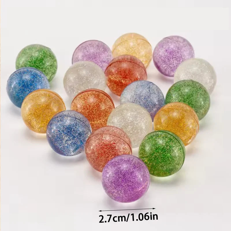 A collection of colorful glitter bouncy balls in various shades including green, purple, orange, and gold.