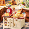 A miniature dollhouse kit featuring a cozy baking kitchen setup with various tools and ingredients.