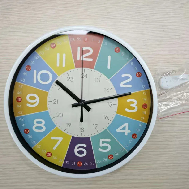 A round analog teaching clock with a colorful face and numbers, showing the time.