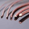 Close-up view of several strands of reddish copper wire coils against a gray background.