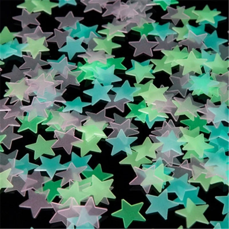 A collection of glow-in-the-dark 3D star wall decor stickers in various shades of green and purple scattered on a dark backgr