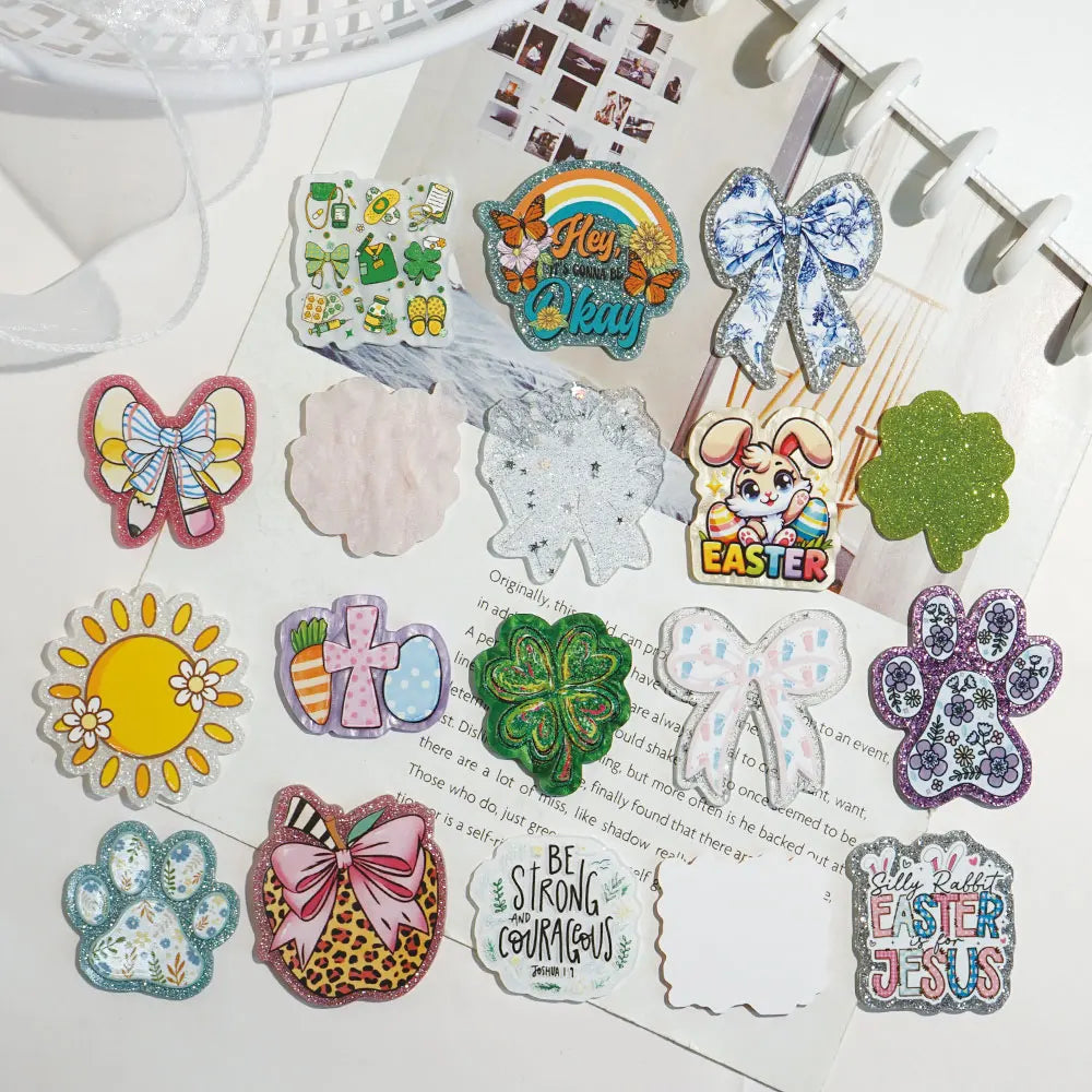 A collection of colorful glitter acrylic flatback resin cabochons shaped like flowers, animals, and seasonal themes for DIY c