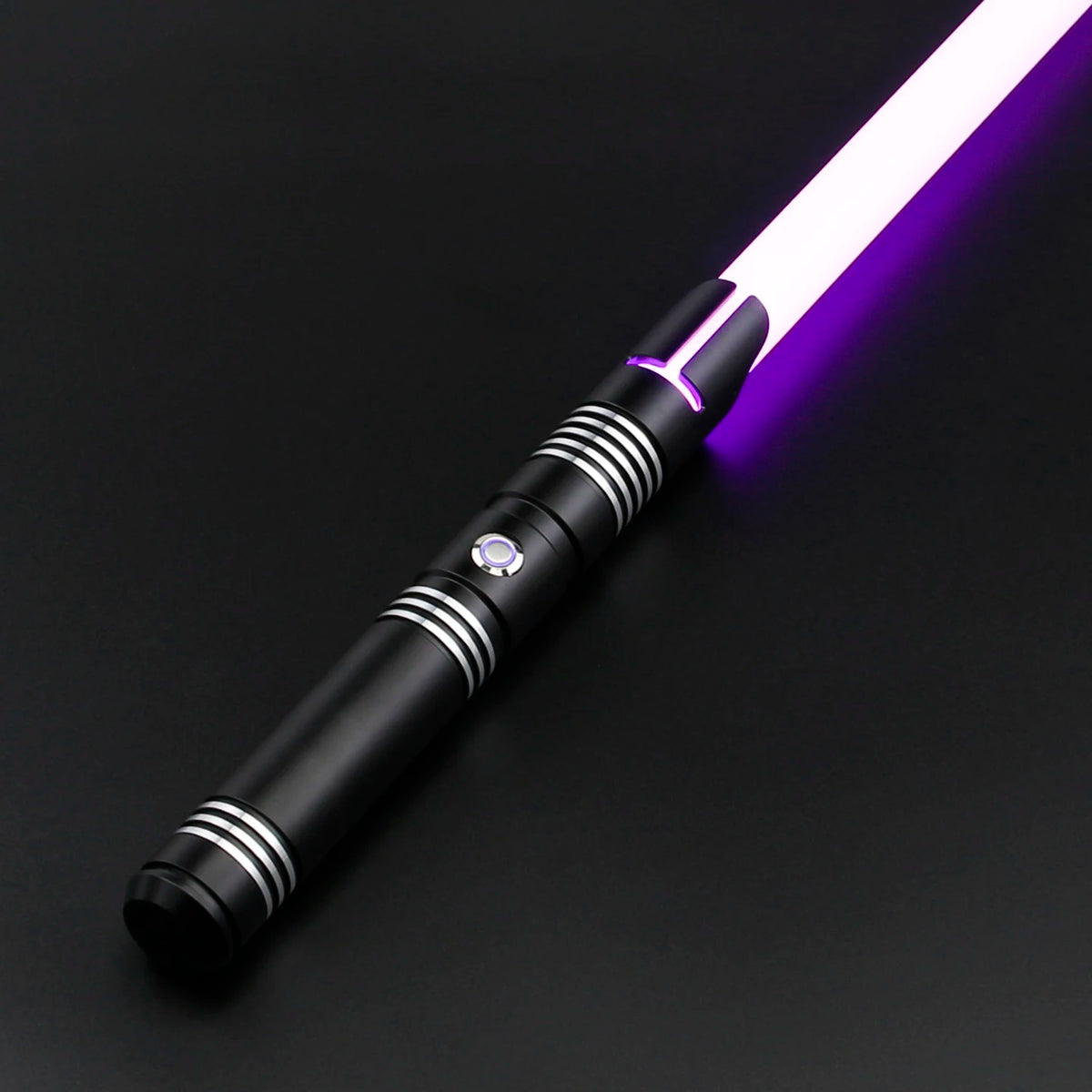 A black lightsaber with a white blade that transitions to purple, featuring metallic accents.