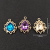Three gold plated water droplet charms featuring blue, purple, and clear crystal rhinestones