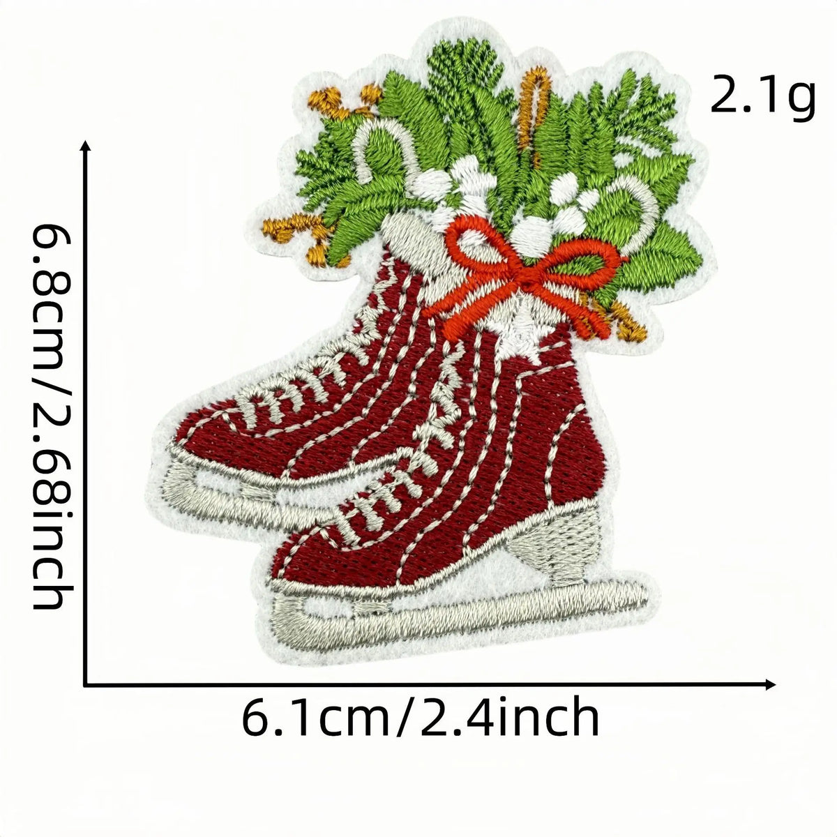 A red boot patch featuring a green foliage wreath and a gold bow, measuring 6.1cm wide by 2.1g.