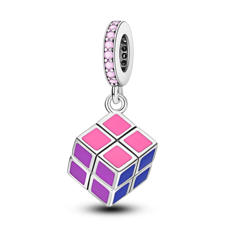 A silver heart charm bead featuring pink zircon stones and a diamond-shaped pink and purple mosaic design.