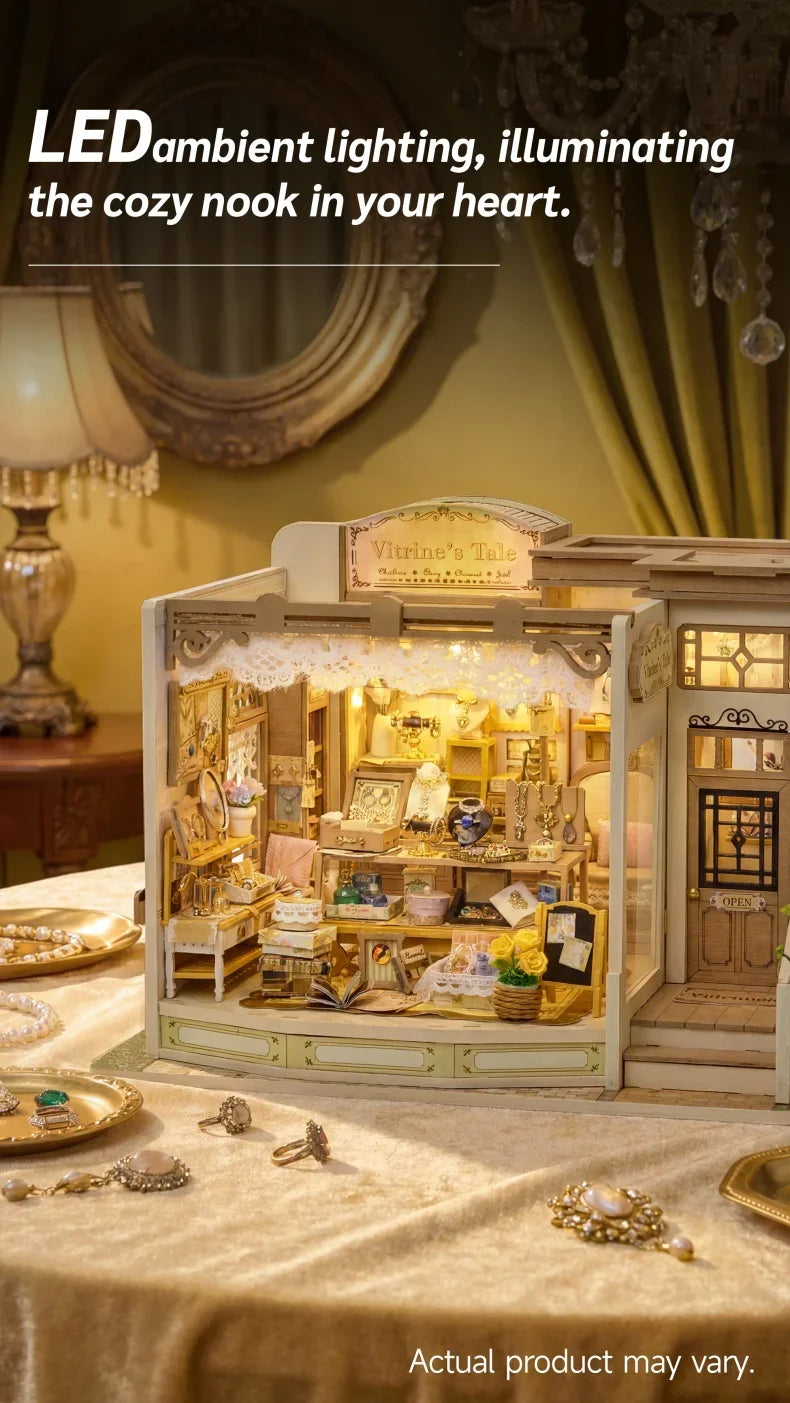 A detailed wooden miniature dollhouse kit displayed on a table, illuminated by warm ambient lighting.