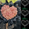 A bouquet of pink roses displayed in black paper, with two heart-shaped wire frames shown separately.