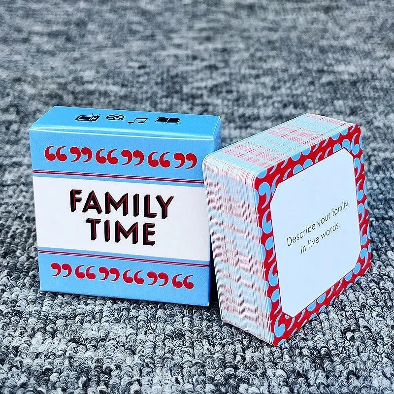 A box of Family Time conversation starter cards with a white label and red polka dots resting on a gray textured surface.