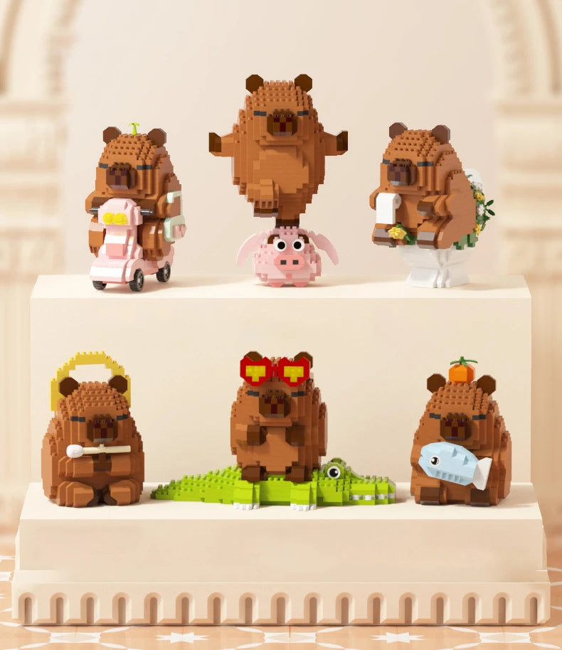 A set of cute capybara micro building blocks featuring various animals and a large brown bear figure.
