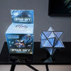 A set of Star Sky Magic Cube puzzles in blue and silver packaging and assembled form, displayed on a black surface.