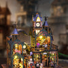 A detailed wooden miniature rail-track city dollhouse kit featuring buildings, shops, and figures.