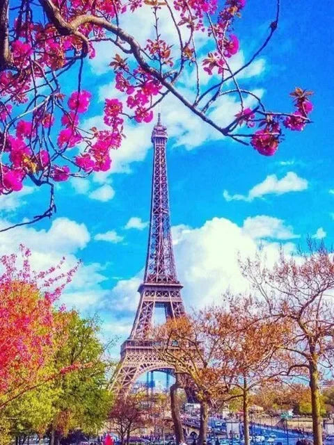 A vibrant painting of the Eiffel Tower framed by pink blossoms against a bright blue sky.