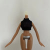 A fashion doll with light blonde hair wearing a black knitted top and silver bottoms.