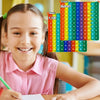 A smiling girl is shown next to a colorful multiplication pop-it math fidget toy chart.