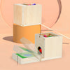 A wooden Montessori toy set featuring a storage box and an open box with colorful wooden manipulative pieces.