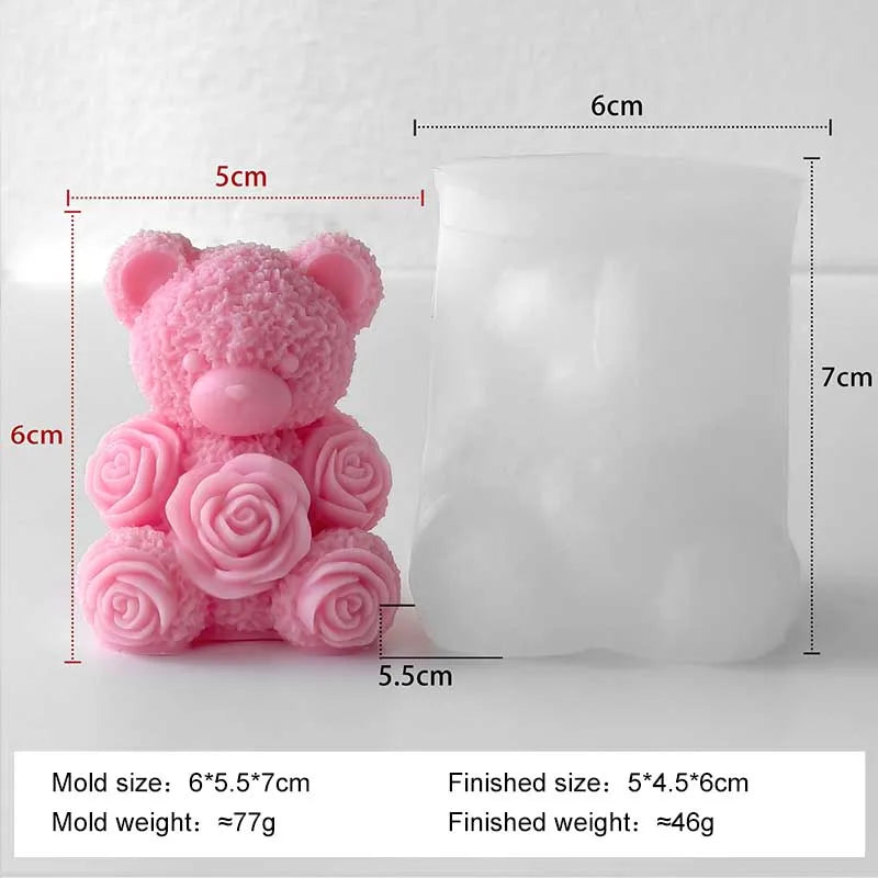 A pink silicone mold shaped like a bear and roses, used for making candles or DIY crafts.