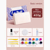 Basic version of La Dell clay kit showing blue packaging, a block of white clay, and various sculpting tools.