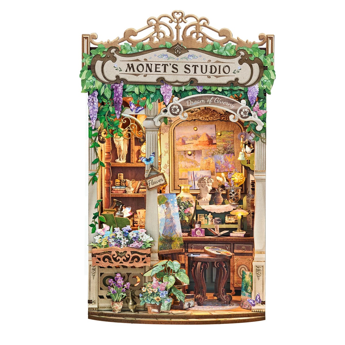 A detailed miniature wooden book nook kit depicting a charming, overgrown studio scene with flowers and rustic elements.