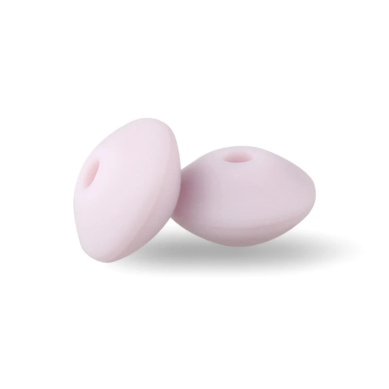 Two smooth, pink silicone lentil beads shaped like an abacus for jewelry making