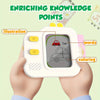 A hand holds a white interactive learning board featuring illustrations, words, and coloring elements like a car drawing.