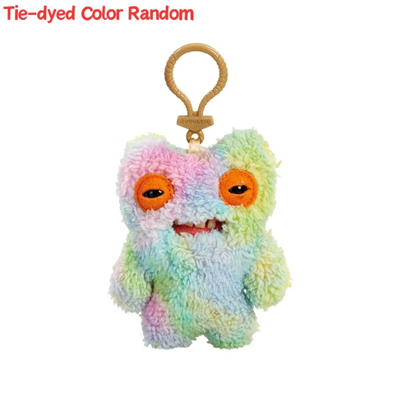 Tie-dyed color random Fuggler funny plush monster keychain with an orange and green rabbit design