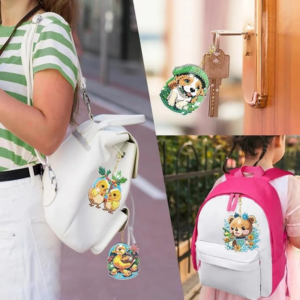 A pink backpack with an owl design and a white canvas bag featuring animal-themed diamond painting keychains.