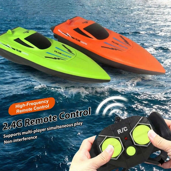 Two orange and green high-frequency remote controlled speed boats floating on blue water.