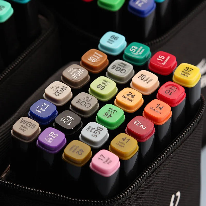 A collection of dual-tip alcohol art markers in various colors and sizes arranged in a black case.
