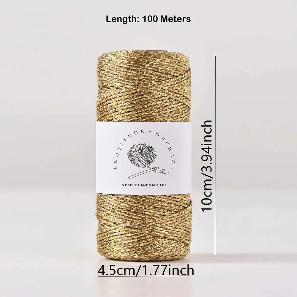 A spool of metallic gold yarn for knitting and crochet, measuring 100 meters long.