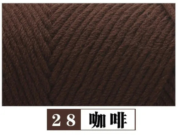 A close-up view of dark brown premium milk cotton yarn used for knitting or crafting.