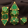 A set of seven premium metal polyhedral dice in vibrant green and gold accents.