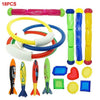 A set of colorful diving toys including a pink tube, yellow rings, and various shaped plastic diving fins.