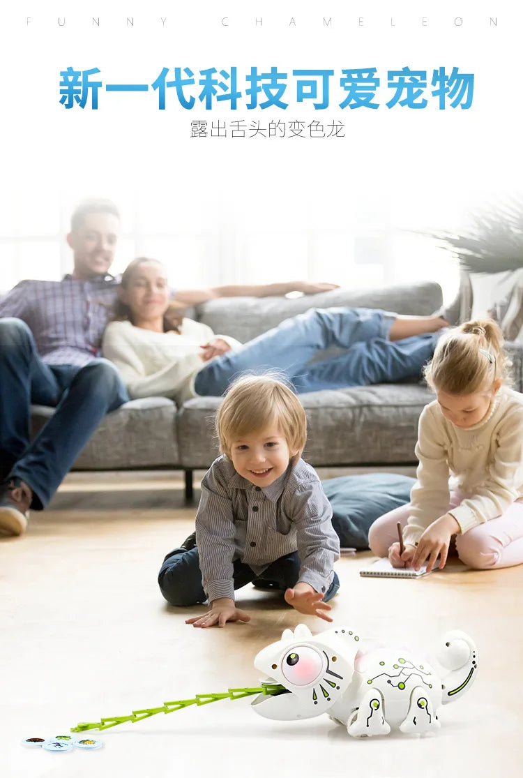 A young child is playing with a white remote control chameleon toy on a wooden floor.