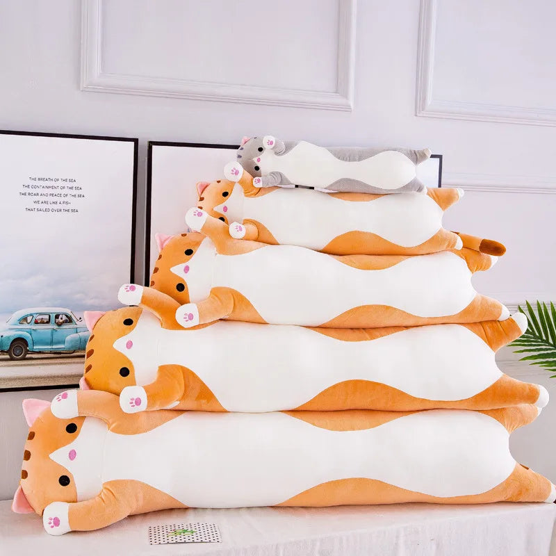 A stack of orange and white plush cat pillows for sofa and bed