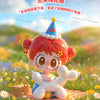 A cute figurine of a girl with red hair wearing a party hat and a white puppy, set against a colorful floral background.