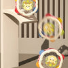 A set of colorful baby musical instruments including a hand drum and shake rattle for toddlers.