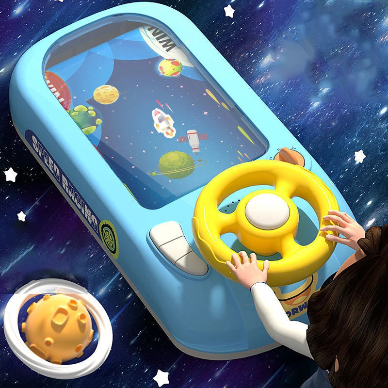A hand is gripping a yellow steering wheel on a blue toy vehicle that simulates space travel with stars and planets visible t