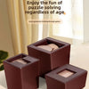 A set of dark brown wooden magic boxes containing puzzle pieces for a 3D block challenge.
