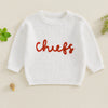 White knit sweater for kids with red embroidery spelling out chiefs