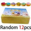 A box of 12 random squishy dumplings stress balls in various colors and shapes.