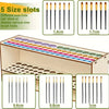 Wooden art brush and pencil organizer with five size slots showing different brush sizes.